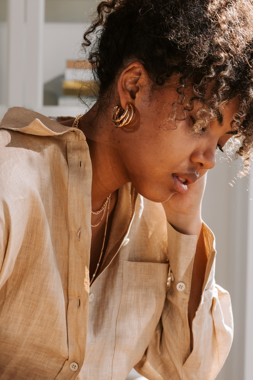 Woman Wearing Gold Jewelry