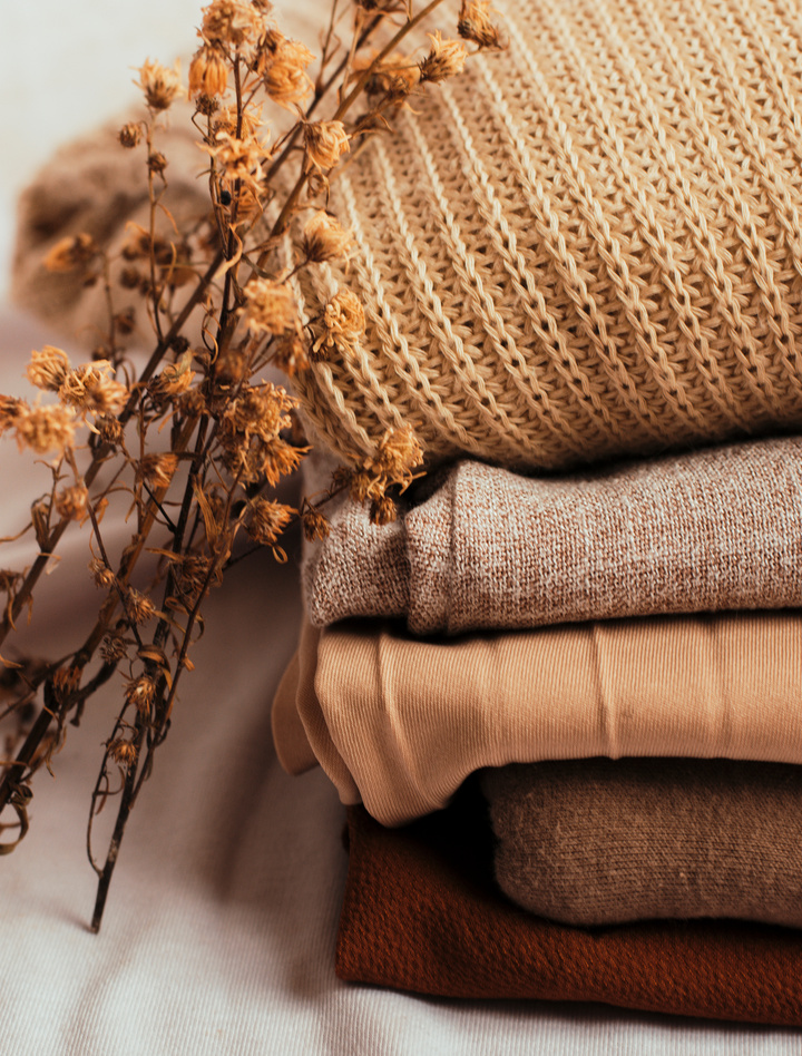 Stack of Folded Clothes with Dry Flowers